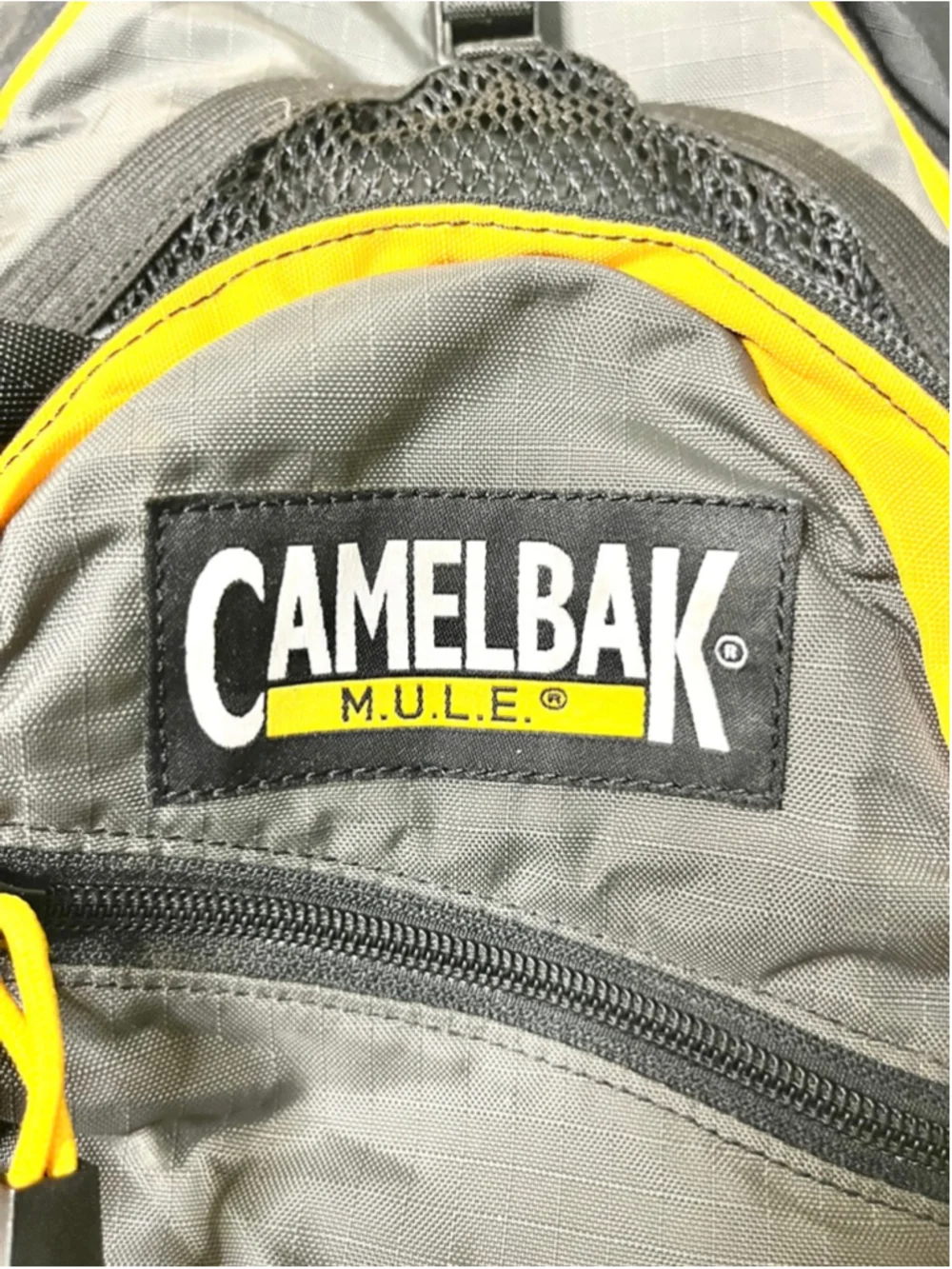 CamelBak M.U.L.E. hydration backpack features distinct yellow trim